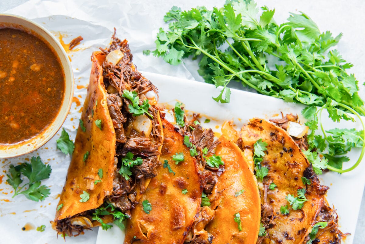 birria tacos on a white serving platter