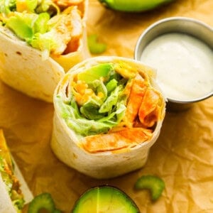 Chicken burritos with avocado, salsa, and buffalo chicken wrap.