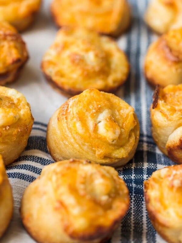 Garlic Cheese Bread Roll Ups are a fun and cheesy recipe that you can serve with any meal. These little garlic rolls are easy to make and so darn delicious!