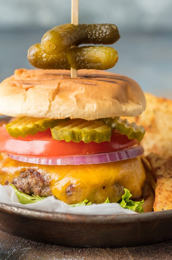 Stovetop Burgers are easier than you  might think! Once we learned How to Cook Burgers on the Stove it's our go-to easy dinner for anytime of year. Cooking Burgers on the Stove is a great way to make sure you cook a JUICY and PERFECT Stovetop Burger each and every time. Hamburgers on the Stove is the only  way to cook cheeseburgers!