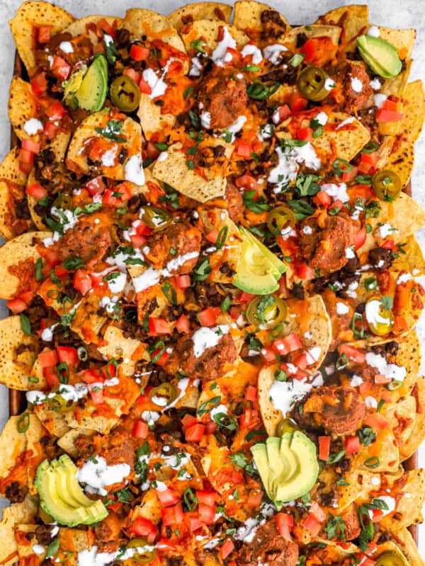 overhead view of nachos supreme on a baking sheet,