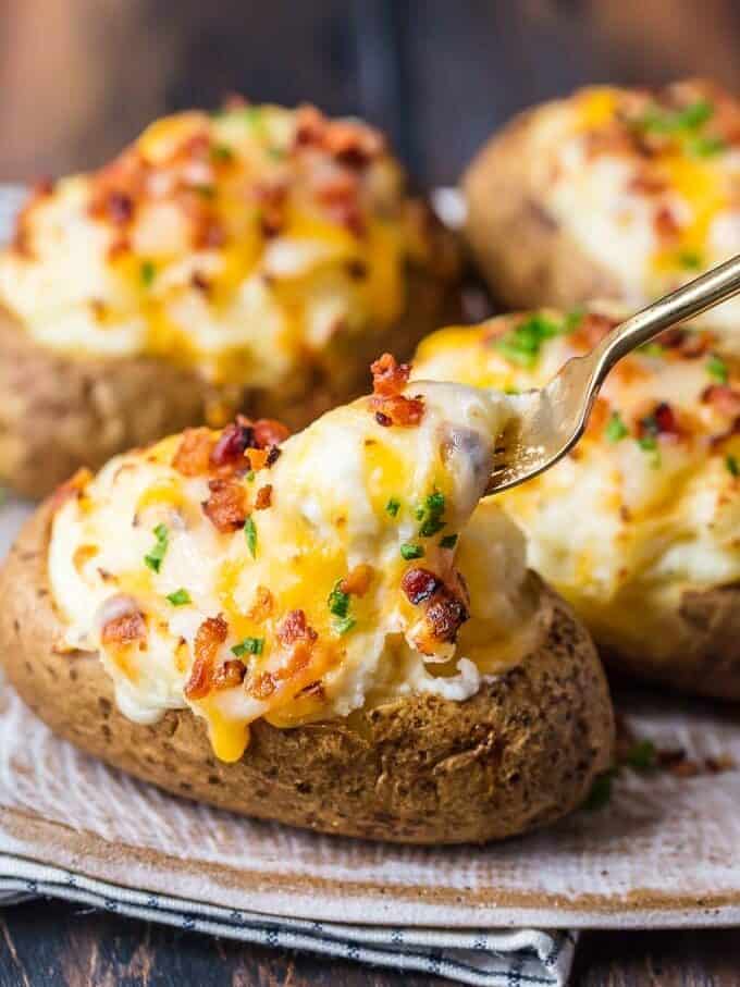 This is the BEST TWICE BAKED POTATOES RECIPE and I'm going to tell you exactly how to make it. This creamy, cheesy, crispy Twice Baked Potato recipe is just too good and I can't get enough of it. These potatoes are the perfect side dish for any meal. They are filled with all the best ingredients and they're absolutely filled with flavor too!